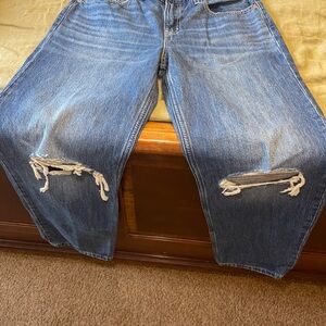 Levi's Blue Boot Cut Jeans with Distressed Knees